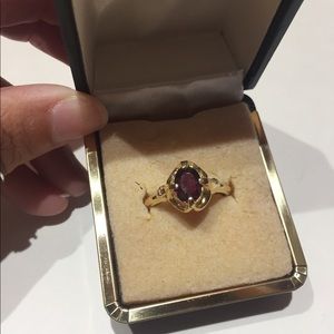 Gold and garnet ring